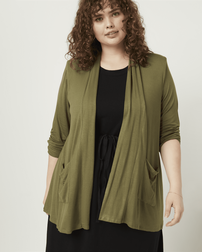 Front of a model wearing a size 1X Valerie Open-Front Cardigan in Olive Green by CAMEO APPEARANCE. | dia_product_style_image_id:210026